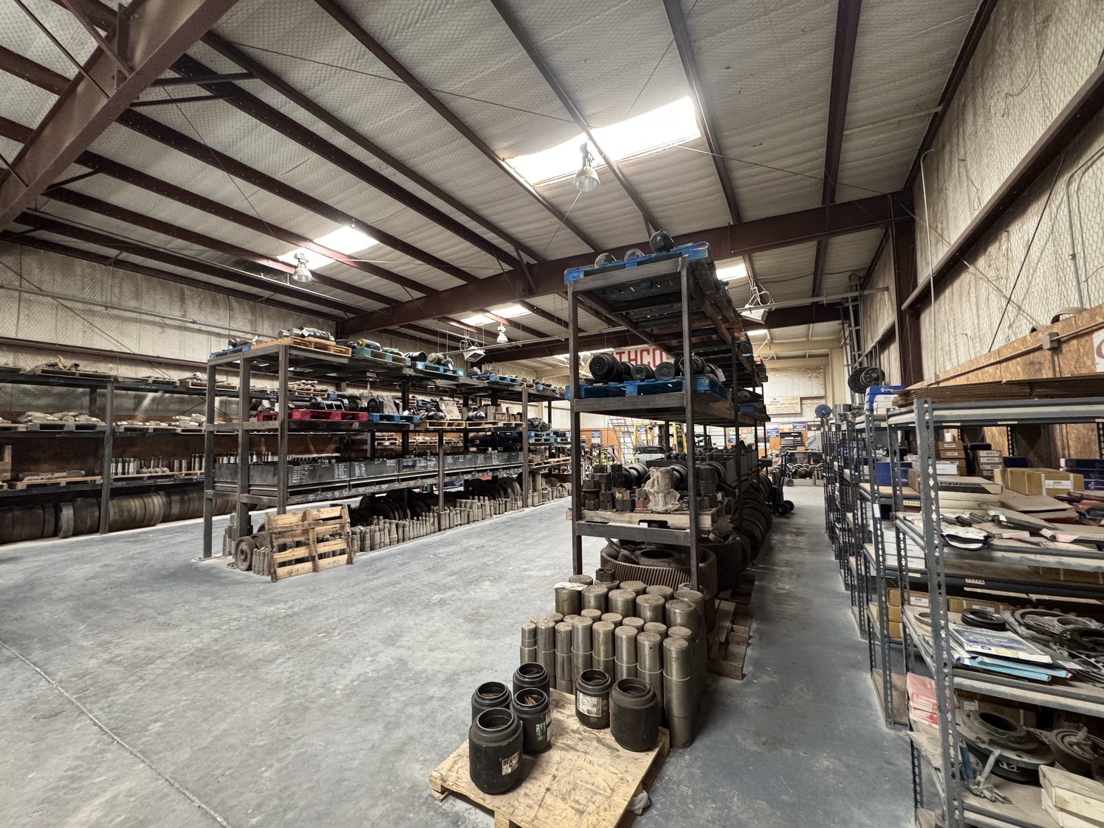 Aisle of in-stock pump jack repair parts at Snelson's, Midland TX