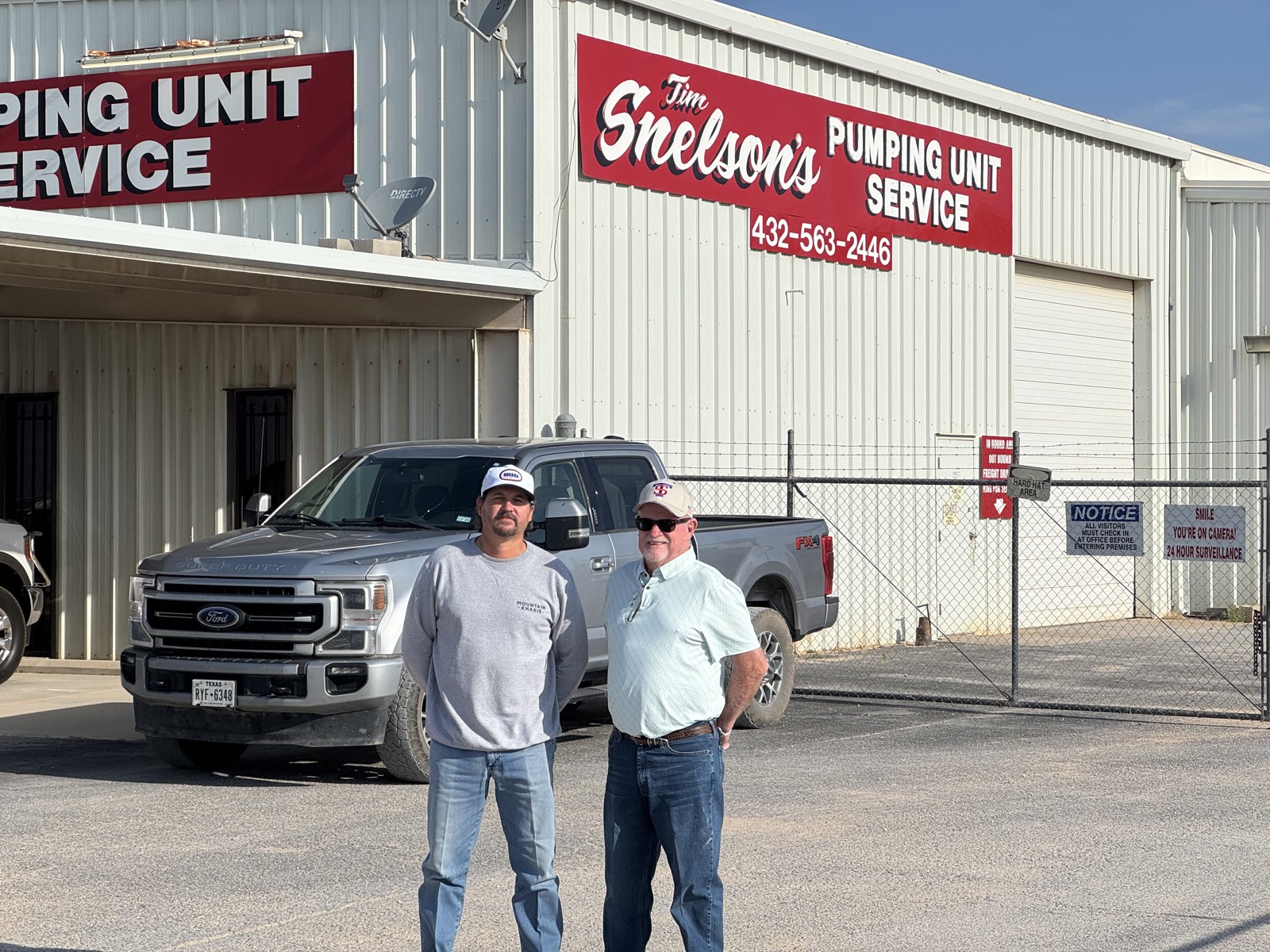 Tim and Dillon Snelson together in front of the Snelson's Pumping Unit Service shop in Midland, Texas